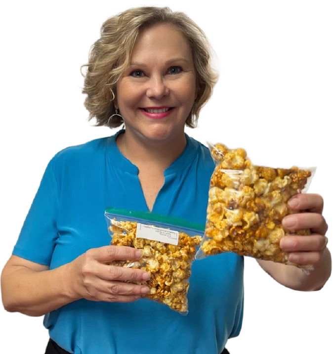 Smiling woman holding popcorn